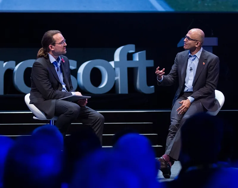 Dave Coplin interviewing Satya Nadella on stage at a Microsoft event