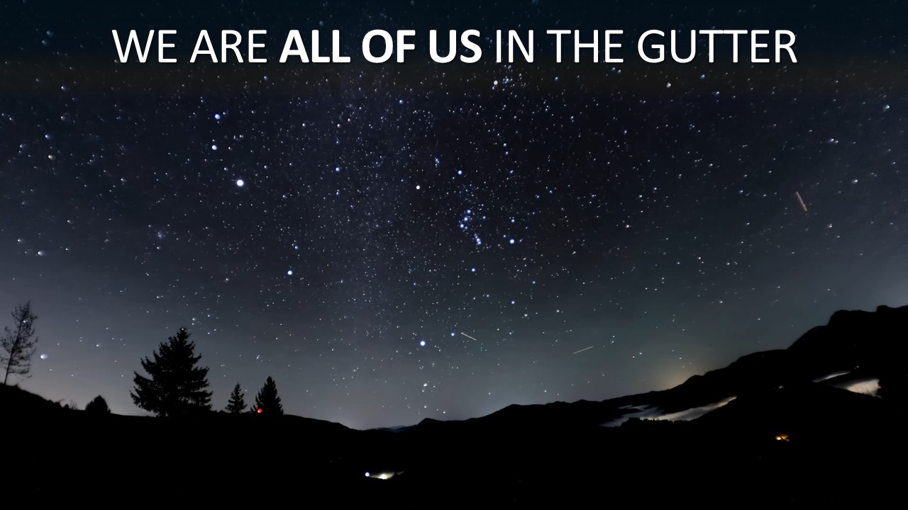 Silhouetted treeline and hills beneath a dense, star-filled night sky with a faint meteor streak, above bold white headline text reading "We Are All of Us in the Gutter" with "ALL OF US" emphasised in heavier type.